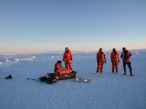 The UAS team (ground control, pilot, radio comms and observers) out on the ice